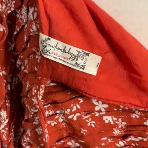 Woven Free People top with bodysuit snaps & back ties that exposes back. Medium